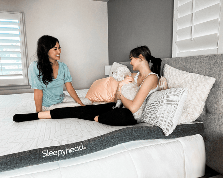 Mother and daughter on Sleepyhead mattress topper